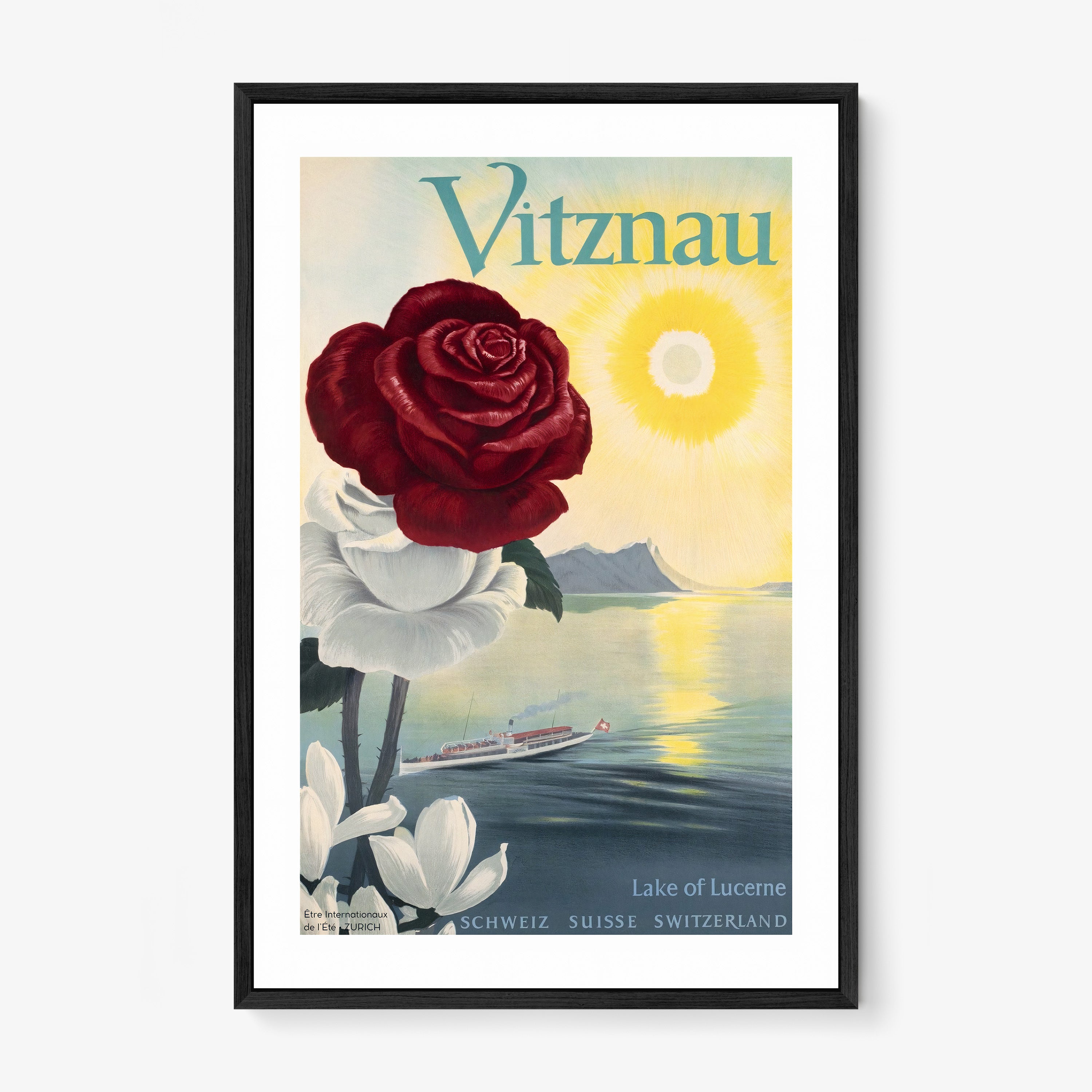 Framed poster of a large rose and an ocean background with the text "Vitznau" at the top hanging on a wall with a light background
