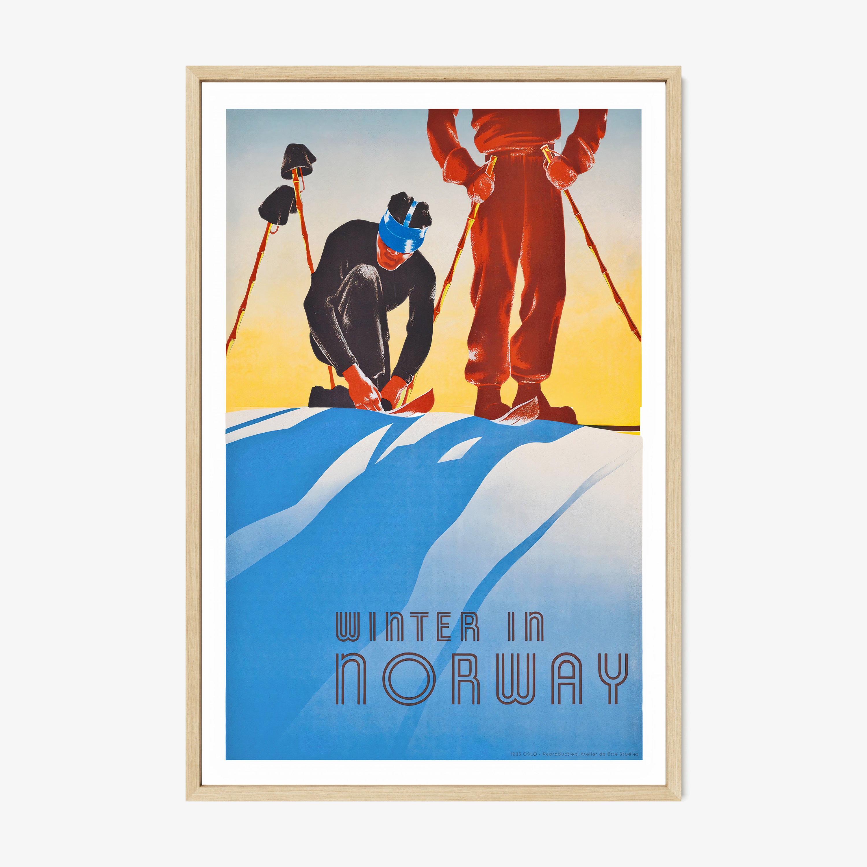 Framed poster featuring two stylized skiers adjusting their equipment against a serene blue and yellow snowy backdrop